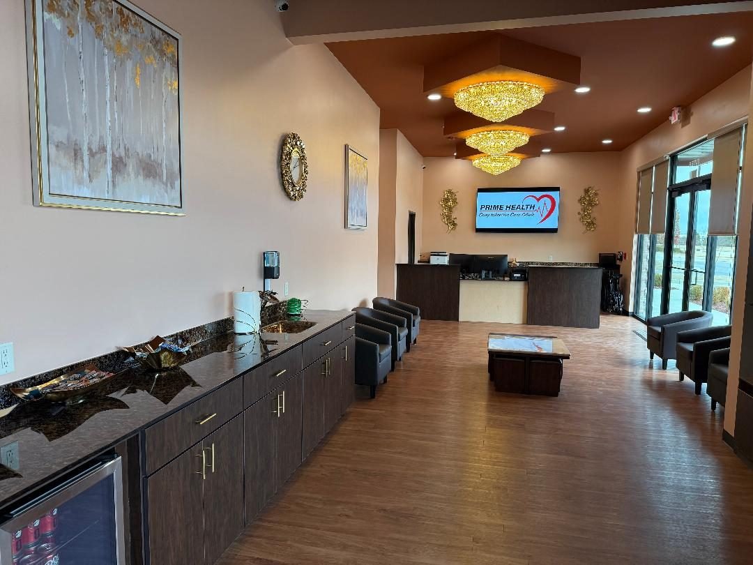 The Prime Health reception desk and lobby with chandeliers and lounge seating