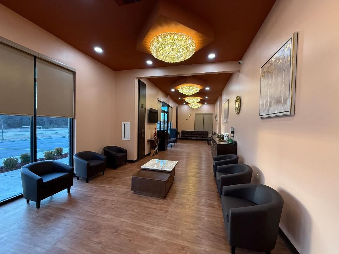 The bright Prime Health waiting lounge with armchairs and large windows